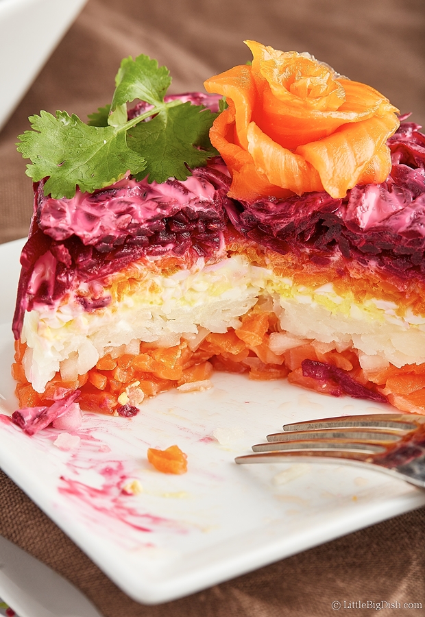 Salmon Salad Cake cut in half, inside layers visible.