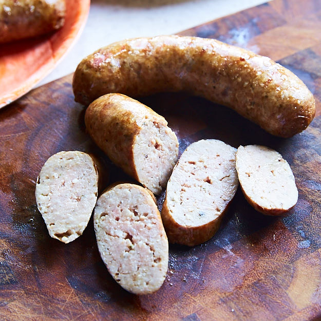 Here is the best way to cook brats to end with juicy, flavorful sausages that snap when you bite into them. Grilled over direct heat, with Mesquite smoke. You may also like Beer Brats using Alton Brown's recipe for that malty beer flavor.