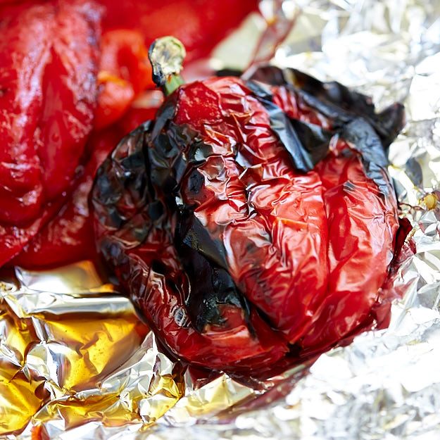Charred bell pepper on foil.