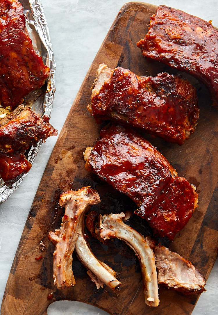 Melt-in-your-mouth-tender Baby Back Ribs Baked in Oven - Show meat falling off the bone