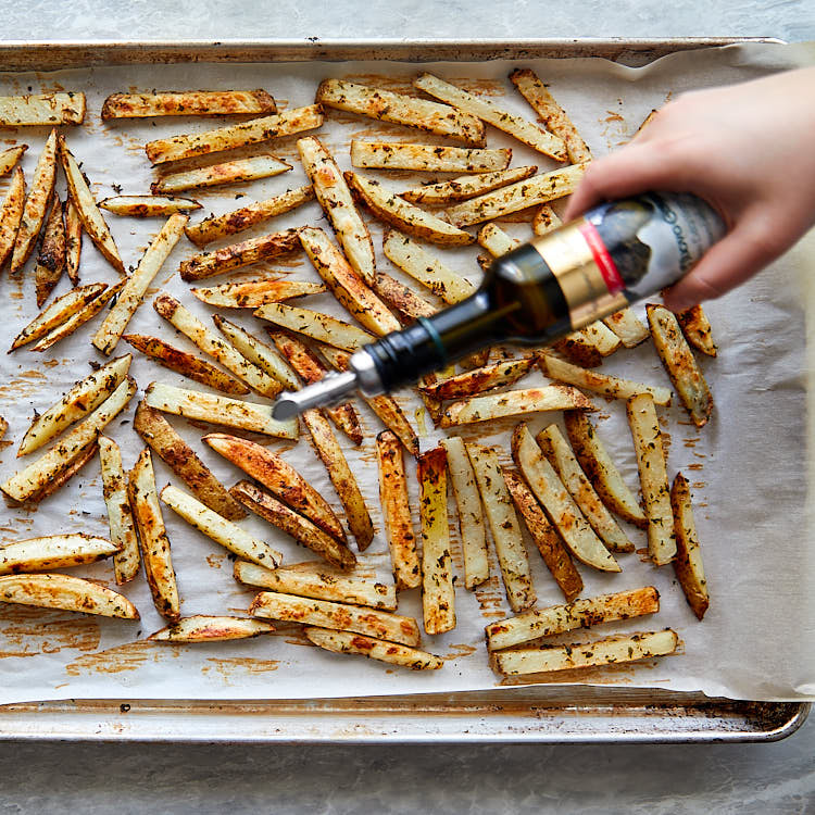 Truffle fries recipe instructions – remove from oven and drizzle with truffle oil