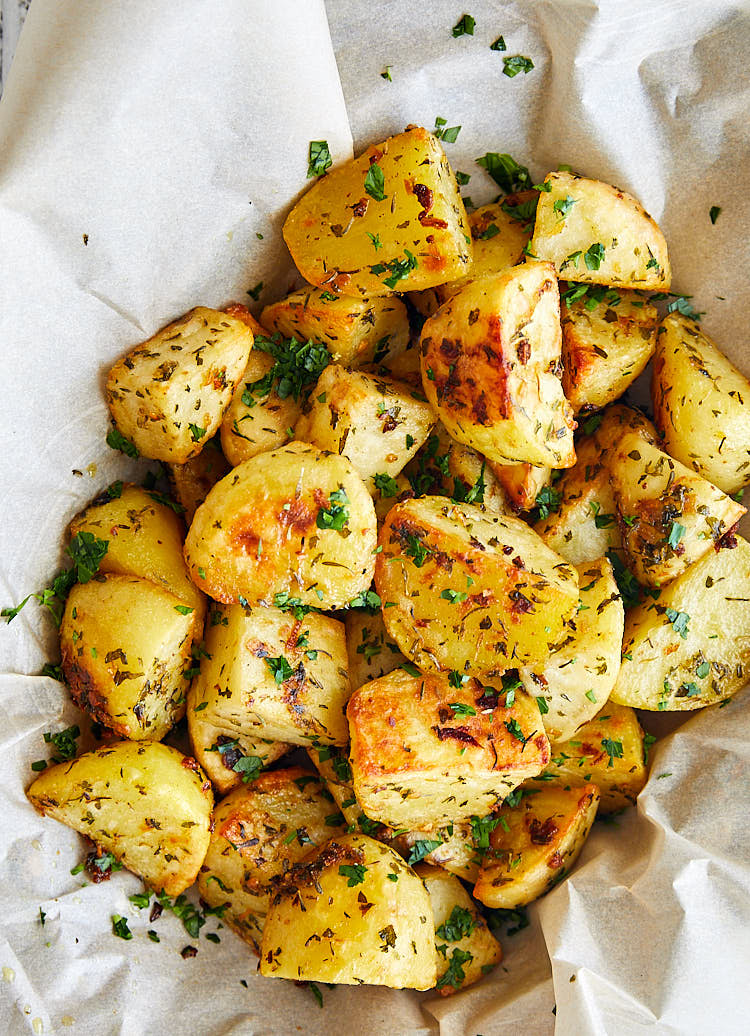 Garlic Roasted Potatoes - garlicky, crisp on the outside, creamy and buttery on the inside, super flavorful and easy to make, all in on one pan. | ifoodblogger.com