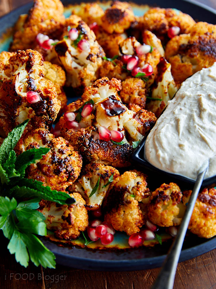 Crispy Roasted Cauliflower with Tahini Sauce and Pomegranate Molasses. You won't find a better tasting cauliflower than this. A must try! | ifoodblogger.com