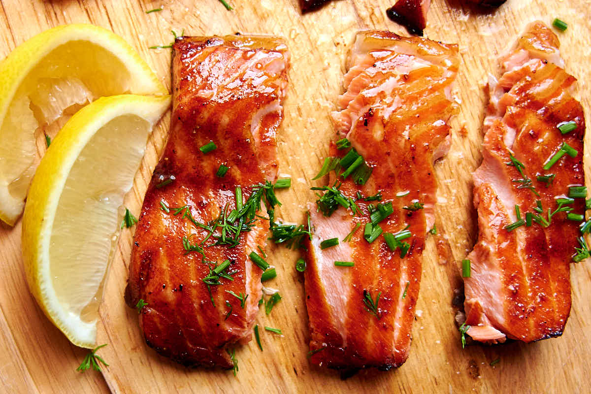 Salmon bellies glazed with delicious Asian inspired sauce and air fried to crispy perfection. This is one of the best salmon belly recipes and is a must try. | ifoodblogger.com